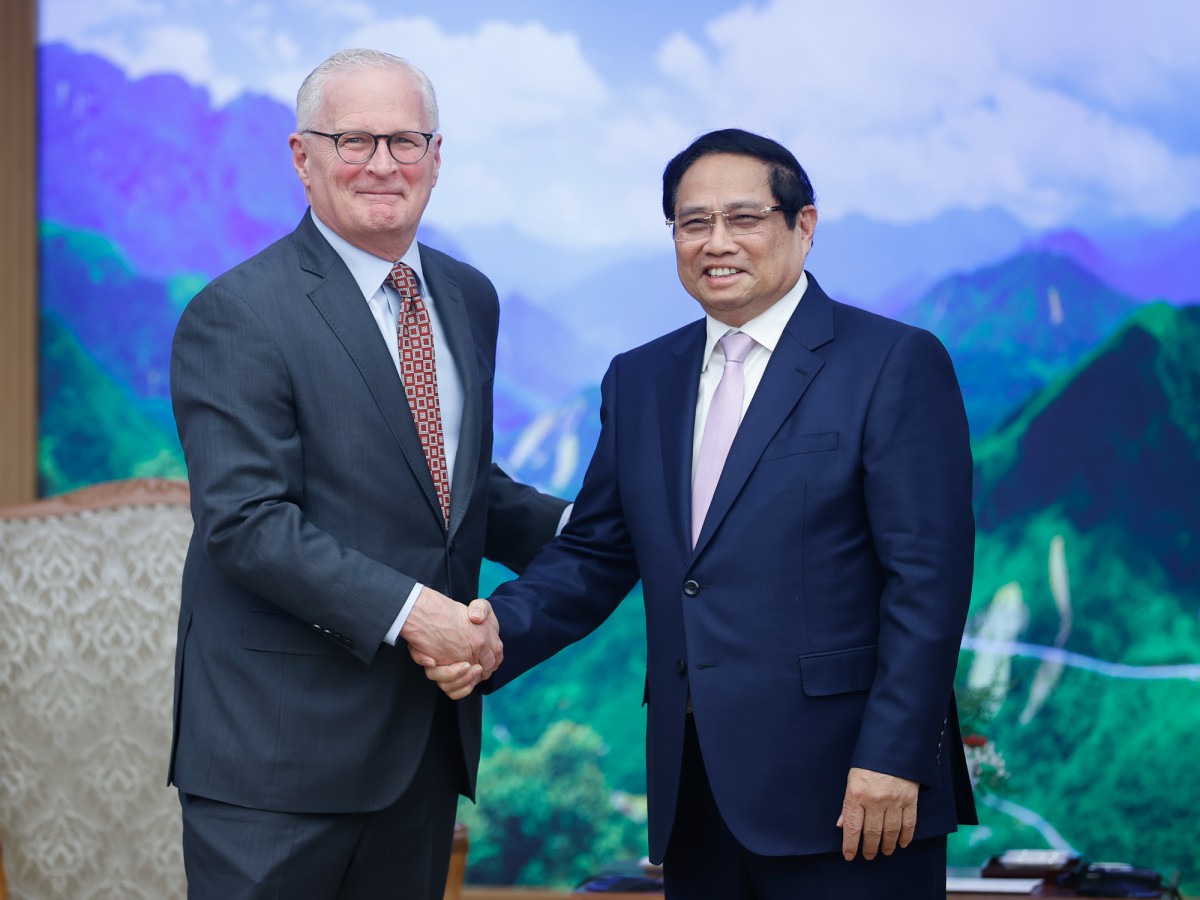 Phiên bản chính thức của 555Win Phạm Minh Chính trao đổi với ông John Neuffer, Chủ tịch Hiệp hội Công nghiệp bán dẫn Hoa Kỳ (SIA) - Ảnh: VGP
