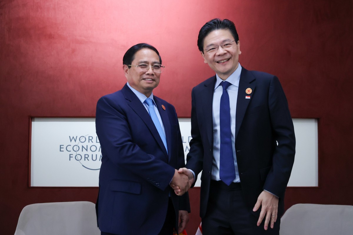 Phiên bản chính thức của 555Win Phạm Minh Chính và Phiên bản chính thức của 555Win Singapore Lawrence Wong. Ảnh: VGP.