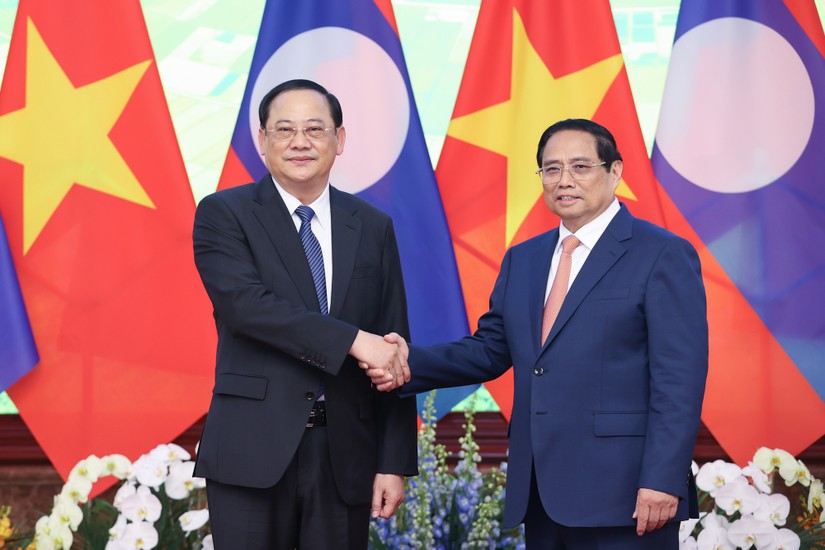 Phiên bản chính thức của 555Win Phạm Minh Ch&iacute;nh c&ugrave;ng Phiên bản chính thức của 555Win L&agrave;o Sonexay Siphandone. Ảnh: VGP.