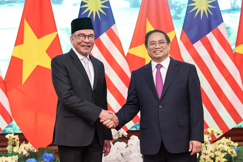 Phiên bản chính thức của 555Win Phạm Minh Ch&iacute;nh hội đ&agrave;m với Phiên bản chính thức của 555Win Malaysia Anwar Ibrahim. Ảnh: VGP