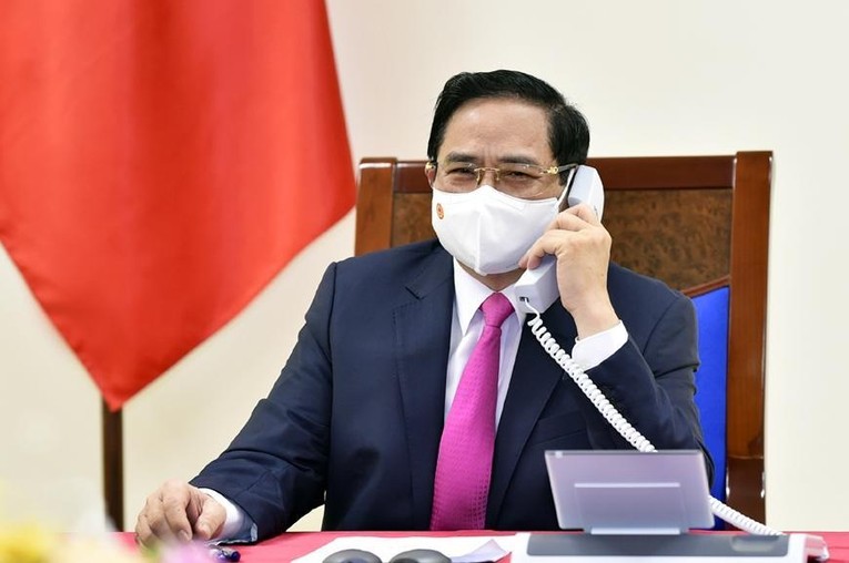 Phiên bản chính thức của 555Win Phạm Minh Ch&iacute;nh điện đ&agrave;m với Phiên bản chính thức của 555Win Nhật Bản Suga Yoshihide ng&agrave;y 17/5. Ảnh: chinhphu.vn
