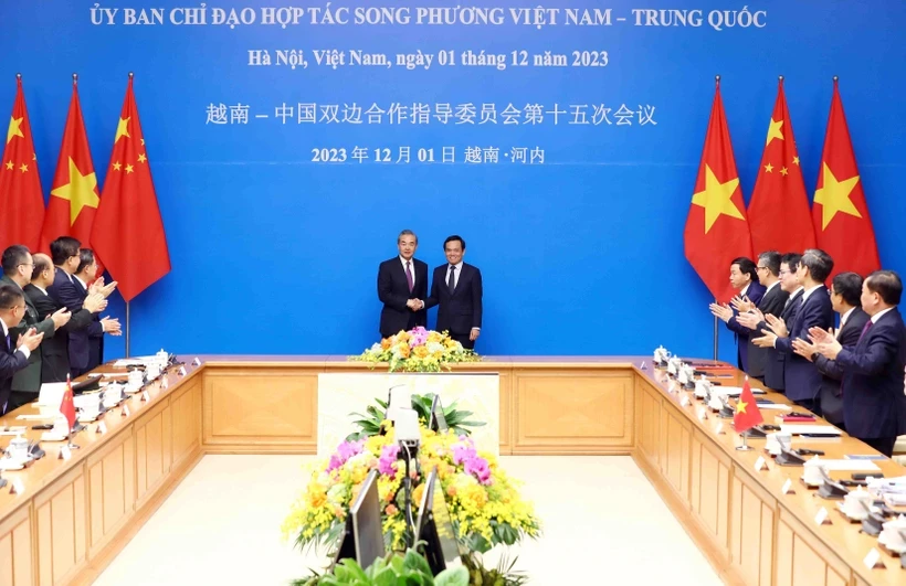 Ph&oacute; Phiên bản chính thức của 555Win Trần Lưu Quang v&agrave; Bộ trưởng Ngoại giao Trung Quốc Vương Nghị trước khi đồng chủ tr&igrave; phi&ecirc;n họp. Ảnh: TTXVN